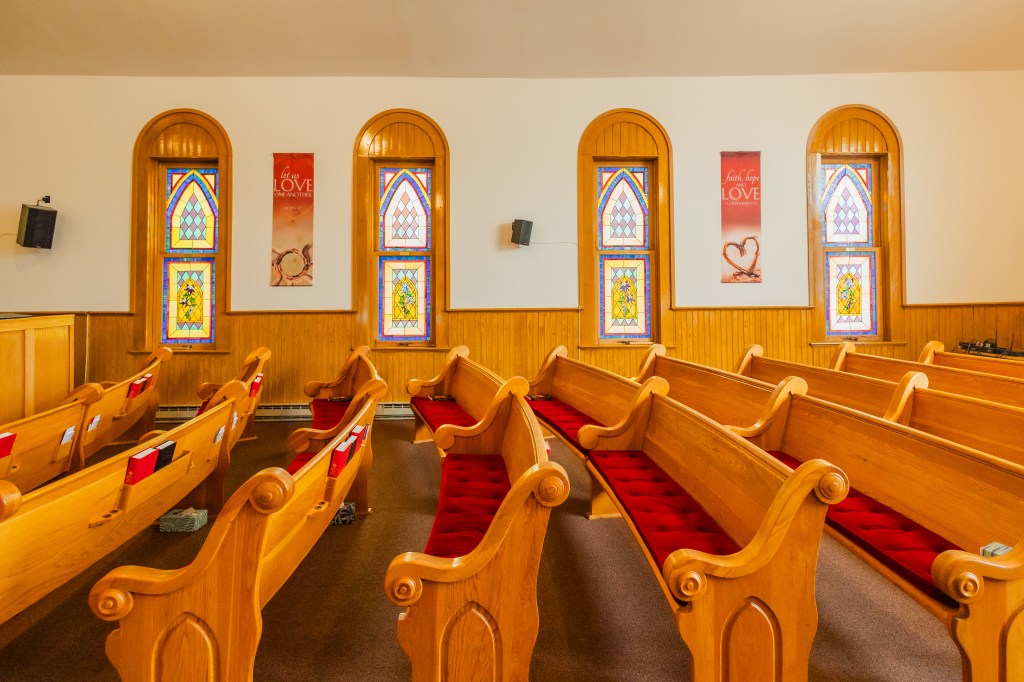 Church pews and stained glass at Hayden Congregational Church United Church of Christ Hayden Colorado